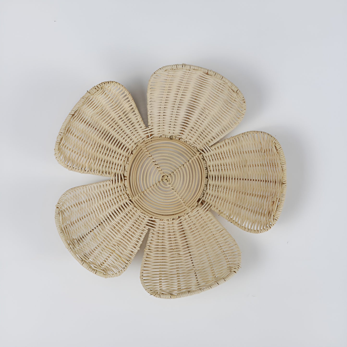 Woven rattan flower wall decor with six petals, close-up view