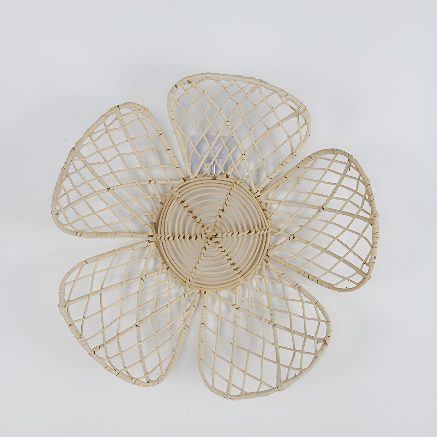 Open-weave rattan flower wall decor with five petals on light gray background