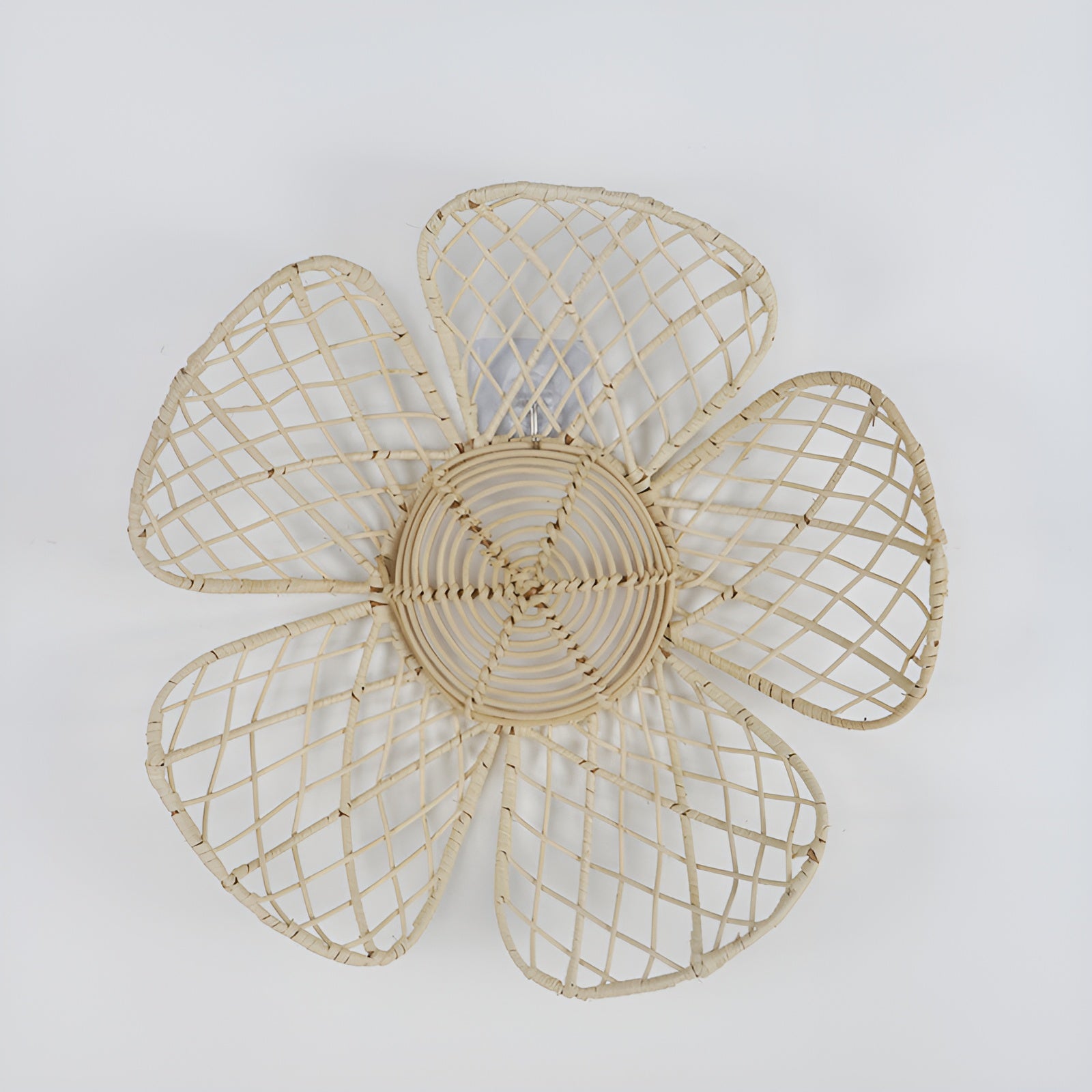 Open-weave rattan flower wall decor with five petals on light gray background